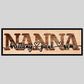 A custom laser-cut wooden sign with the word 'GRANDMA' in bold letters and two names, 'amelia' and 'sarah', personalized on the sign's surface.